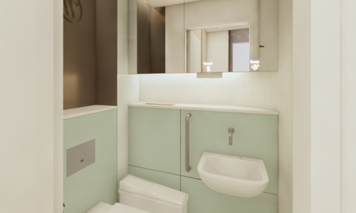 A modern, compact bathroom featuring mint green cabinetry, white fixtures including a wall-mounted toilet and sink, recessed lighting, and a large mirror above the vanity area.
