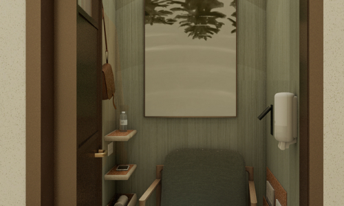A narrow, modern spa treatment room featuring a massage chair with sage green upholstery, warm wood accents, subtle lighting, and a nature-themed artwork on the textured wall.