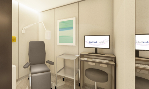 A modern medical consultation room with a gray reclining examination chair, rolling medical cart, computer workstation displaying "Welleck Health" on the monitor, and neutral beige walls with glass partitions separating adjacent rooms.